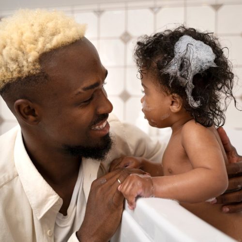 cute-black-baby-home-with-parents_23-2149504676